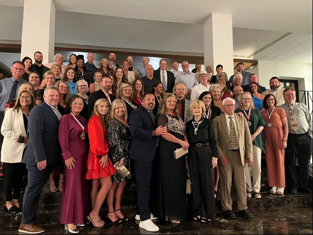 large group of people standing posed