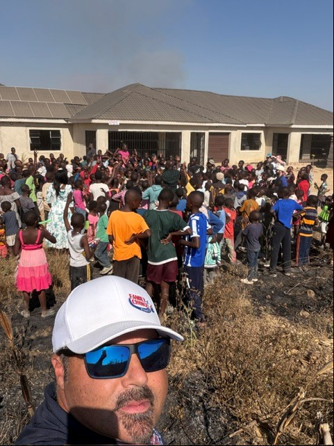 A group of African children in front of a relief center