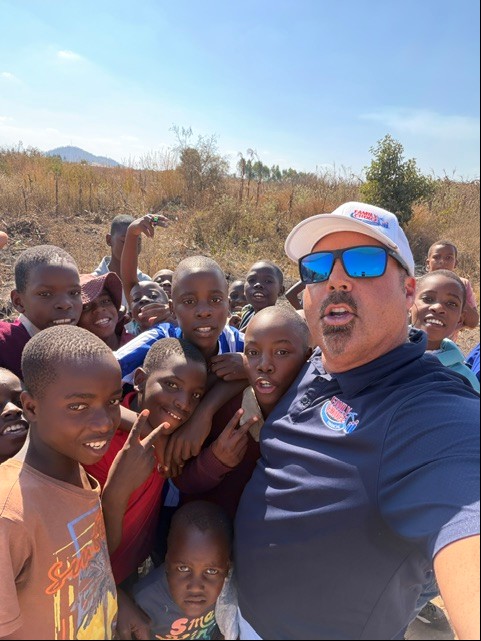 A man with happy African children